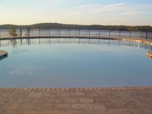 The pool melts into the Lake Martin view