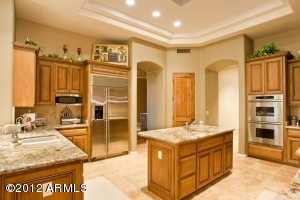 Kitchen with custom cabinets and sliders